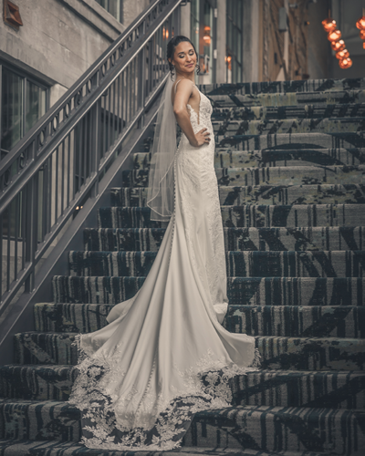 Bride on Stairs at Embassy Suites Rockford Riverfront
